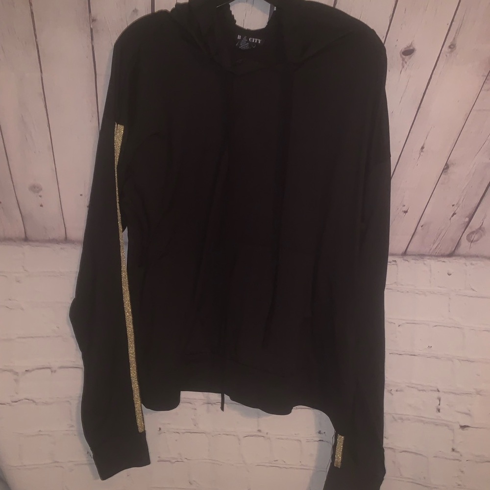 Elegant Black Zip-Up with Gold Detailing
